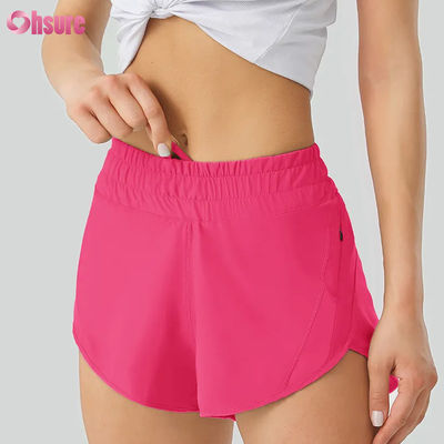 Shorts de ioga casuais femininos Altamente respiráveis Calças de treino de poliéster de secagem rápida com cintura elástica Bolsos para desporto e corrida